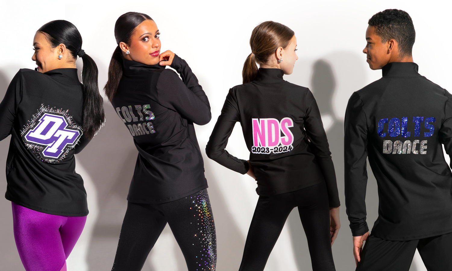 Four individuals wearing black dance practice outfits with visible branding on a white background