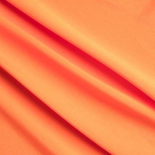 Close-up of orange fabric with folds